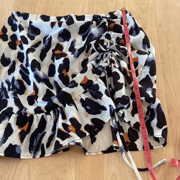 Cheeta print skirt, worn once. Blue, black, brown, and cream. Good condition. - Picture 7 of 10